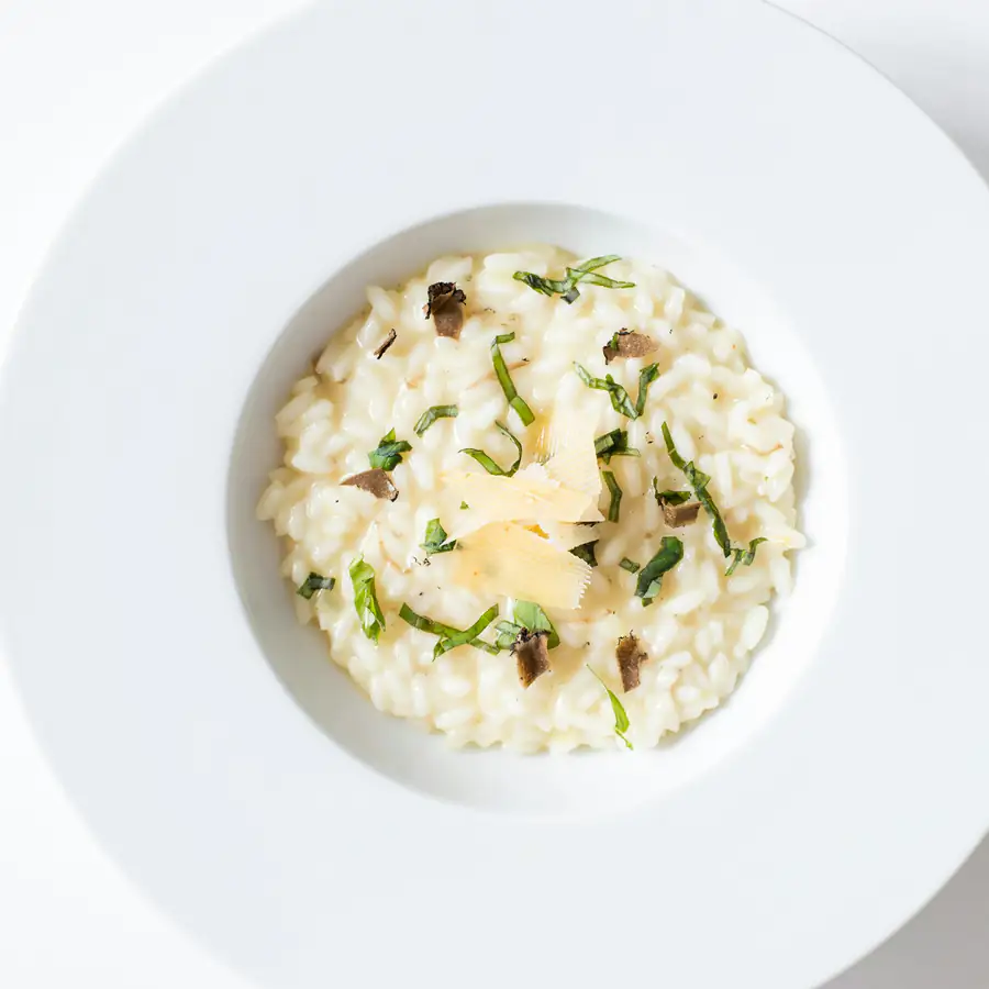Bowl of creamy risotto with herbs