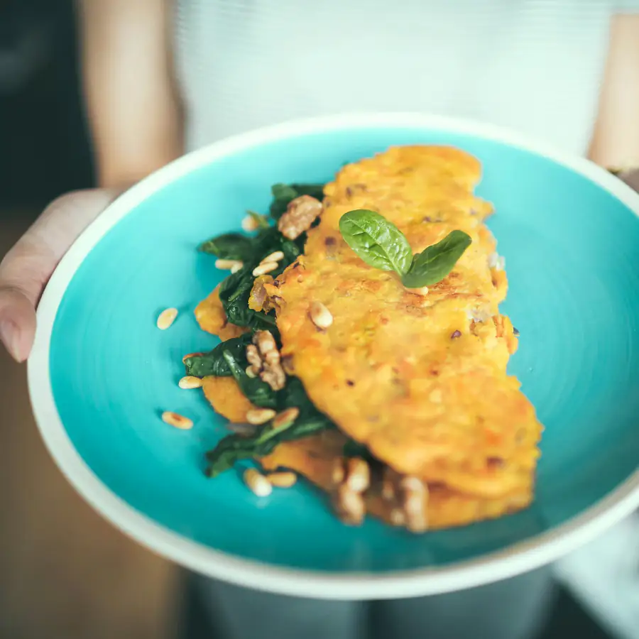 Folded omelette with herbs on a plate