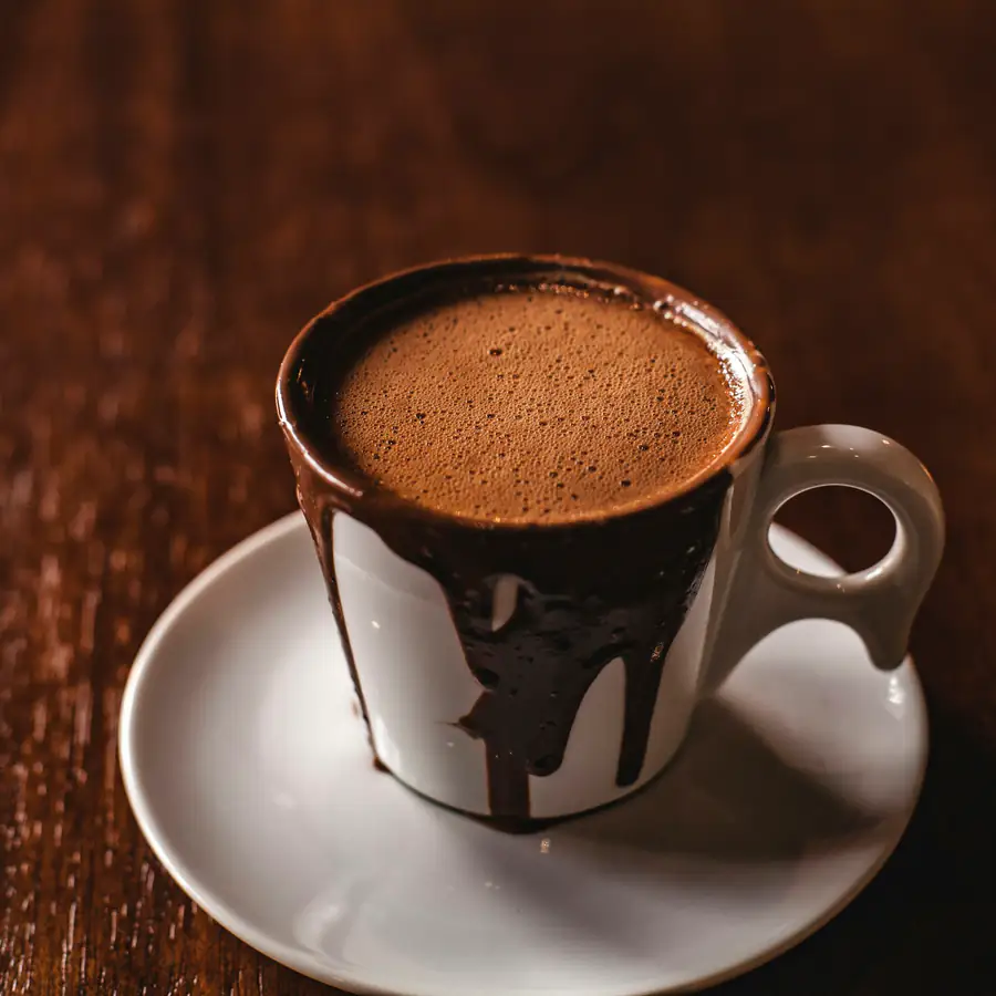 Cup of rich hot cocoa on a saucer