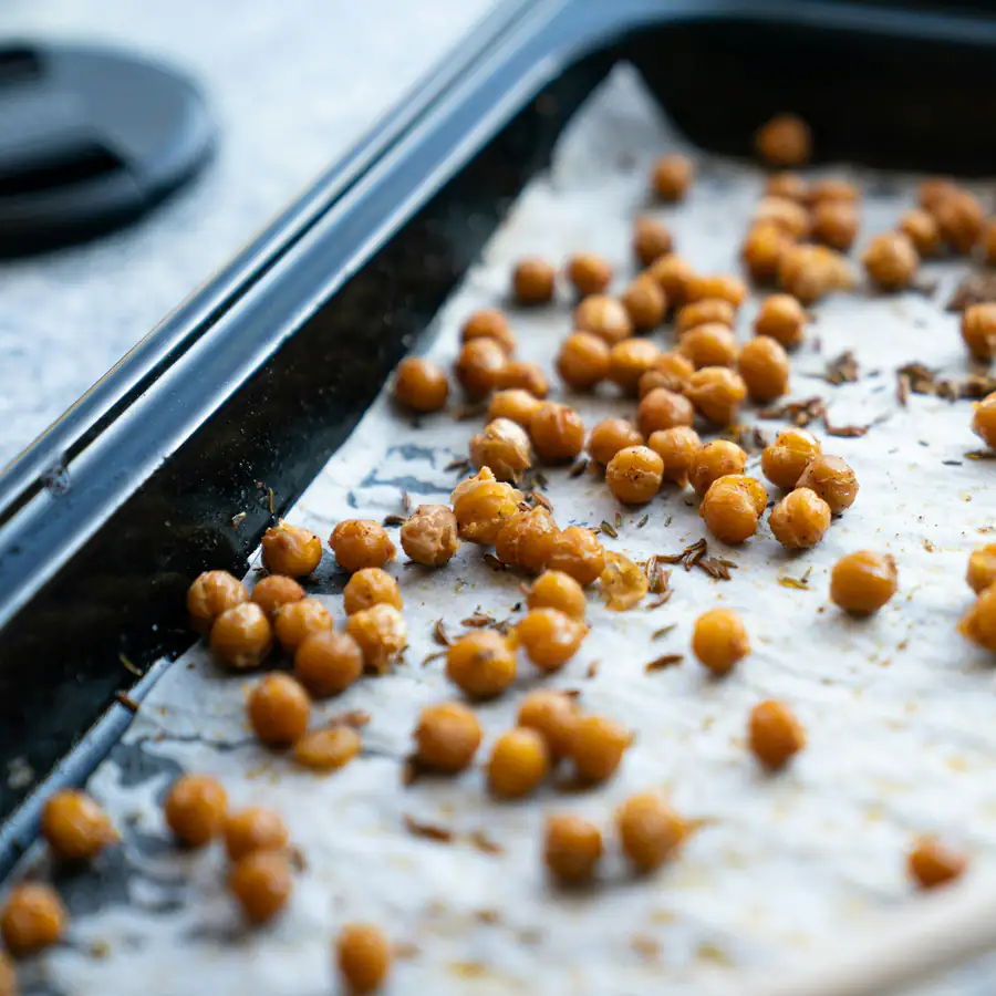 Crispy roasted chickpeas on a baking tray
