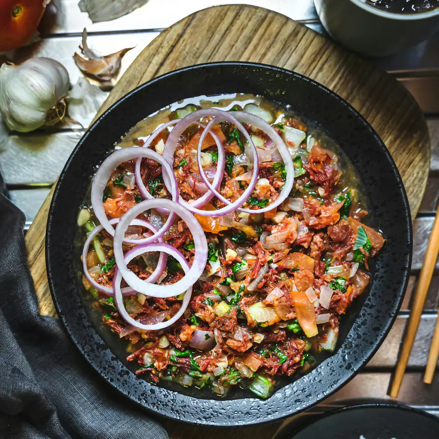 Pan of chilli con carne with onion rings