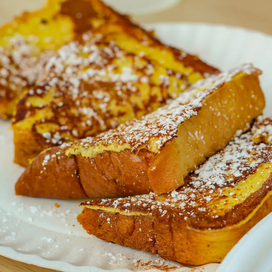 Golden French toast dusted with sugar
