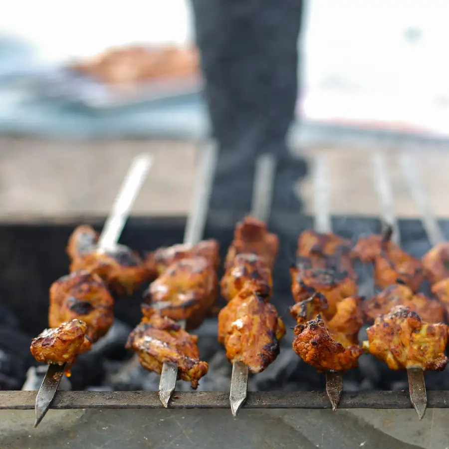Chicken tikka skewers on the grill