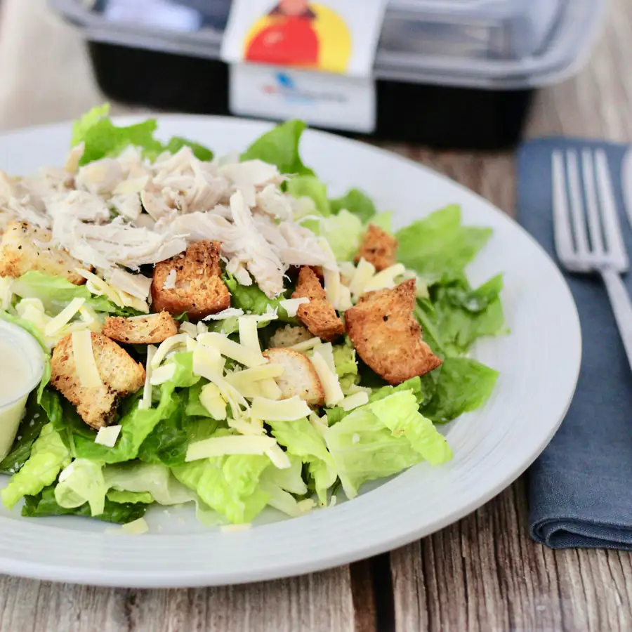 Chicken Caesar salad with croutons and dressing