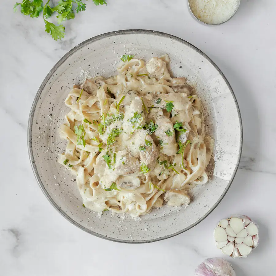 Plate of creamy chicken and mushroom pasta