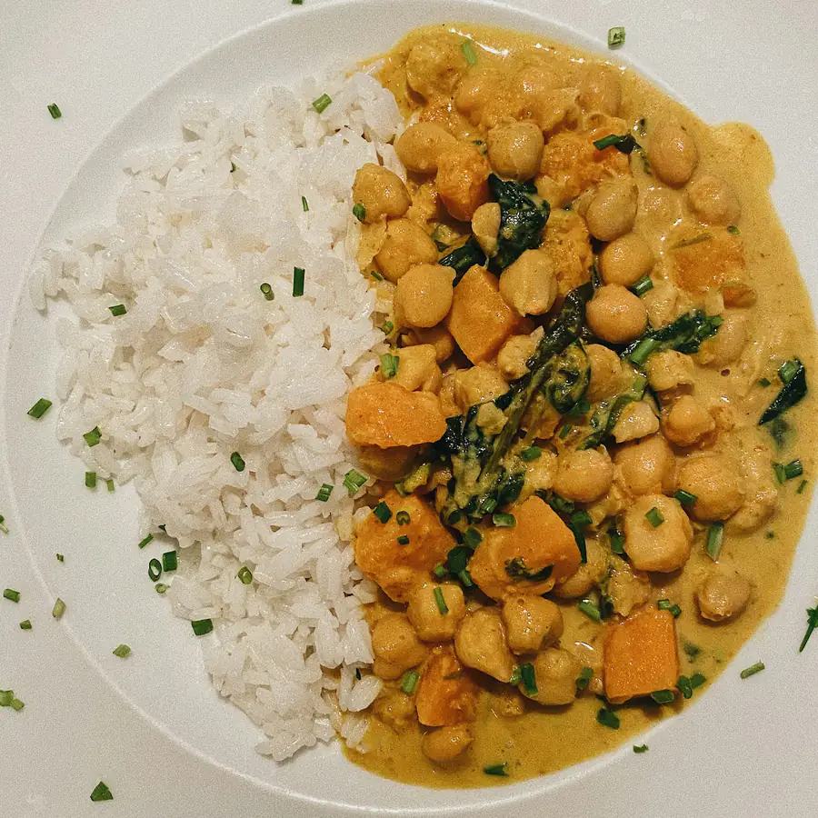 Bowl of chickpea and potato curry with rice