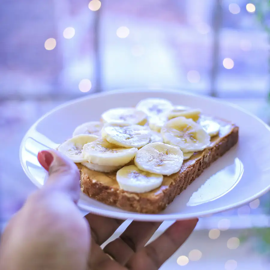 Toast topped with nut butter and banana slices