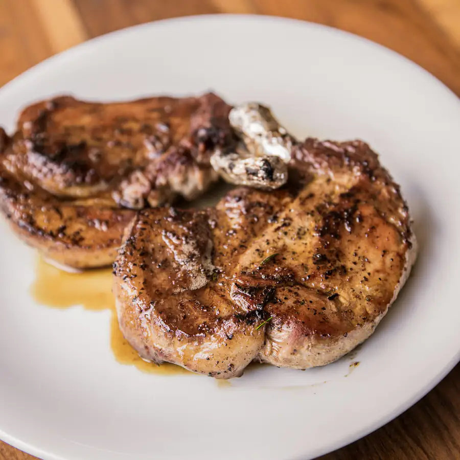 Seared pork steaks on a plate