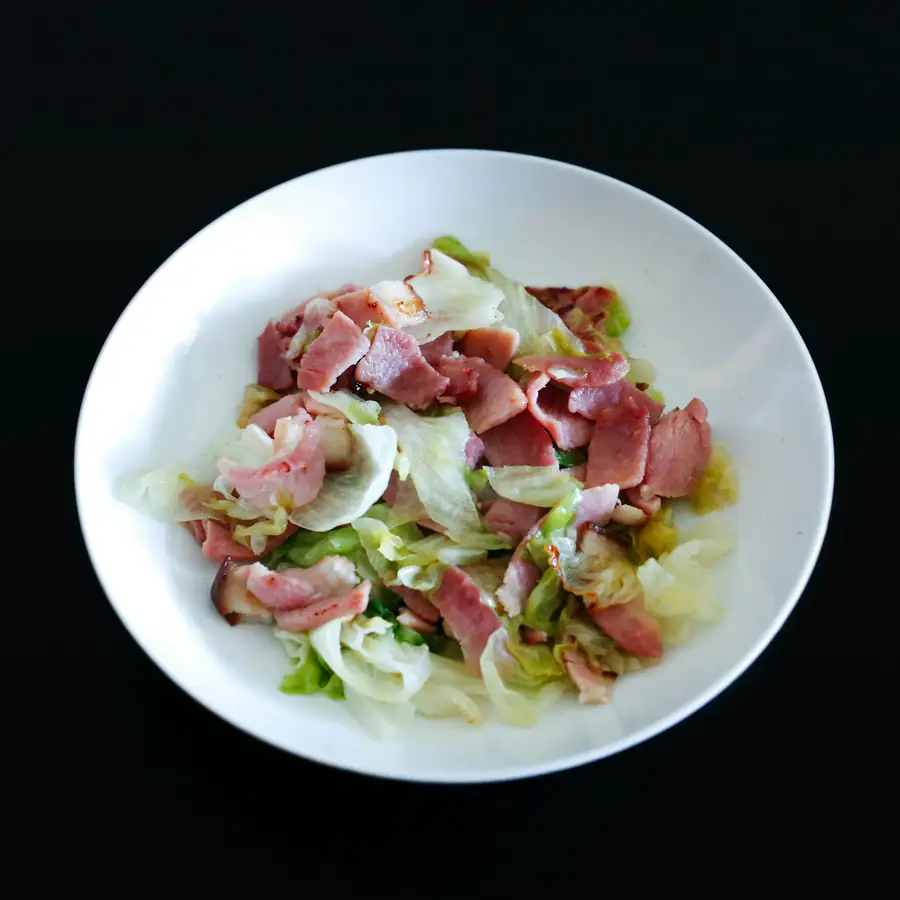 Plate of bacon with greens