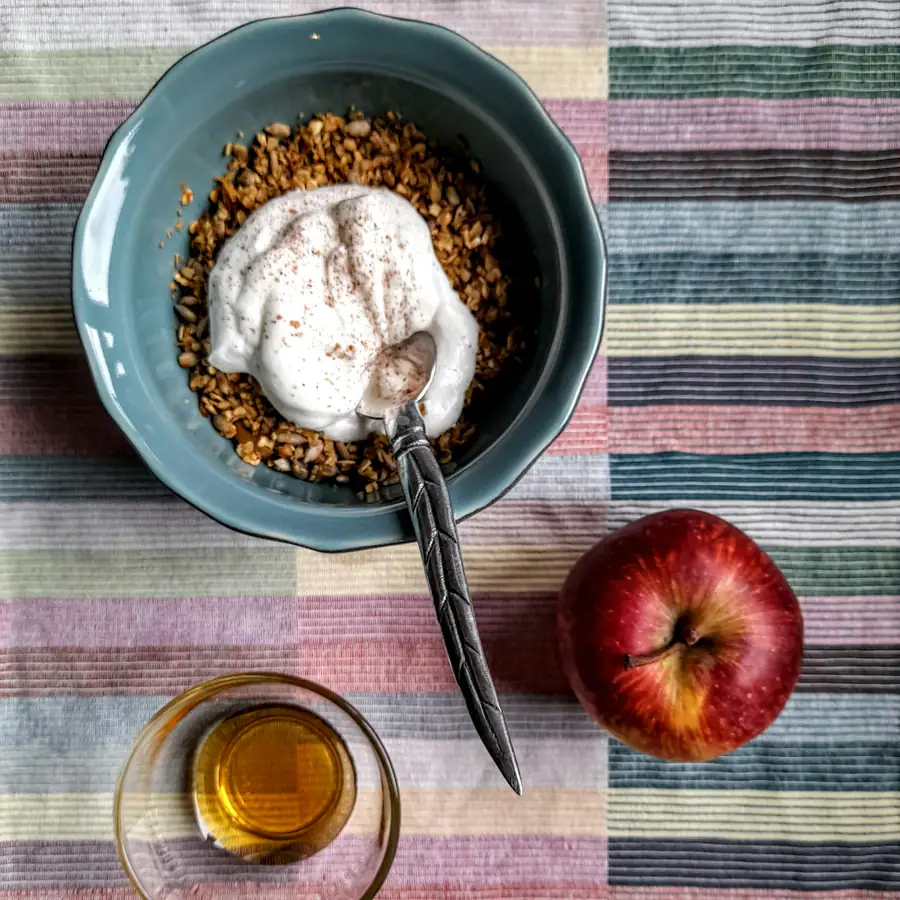 Bowl of yoghurt with cinnamon and apple