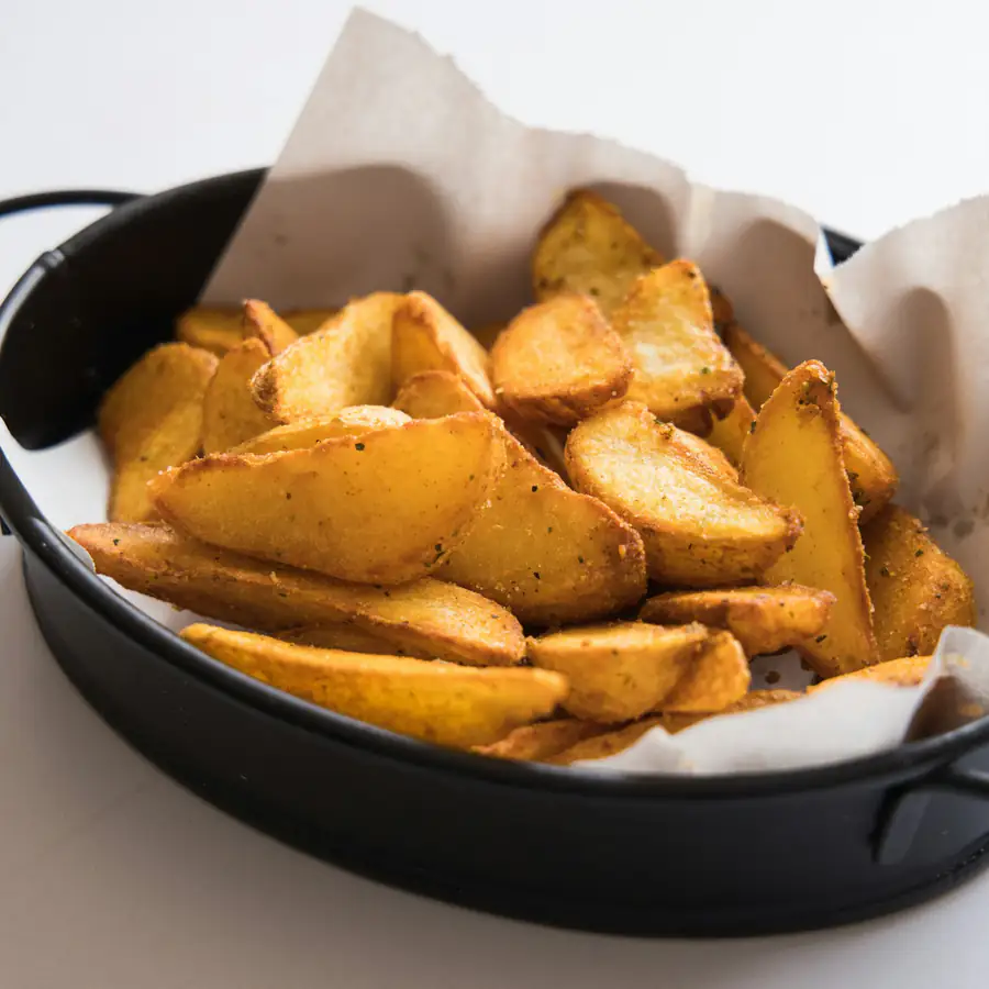 Pan of crisp roasted potato wedges
