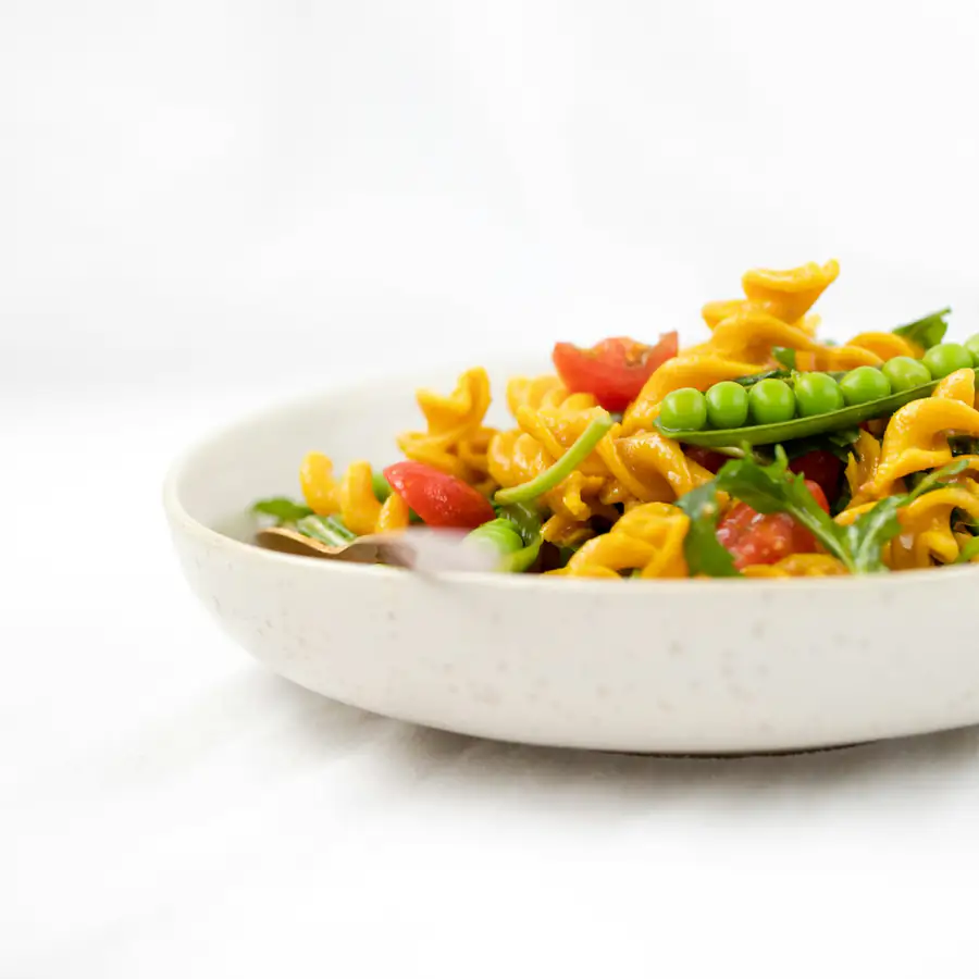 Bowl of pasta with spring vegetables