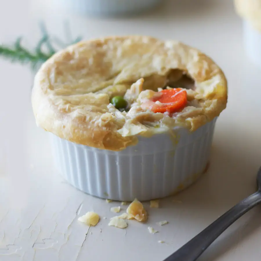 Individual chicken pie with vegetables in a ramekin