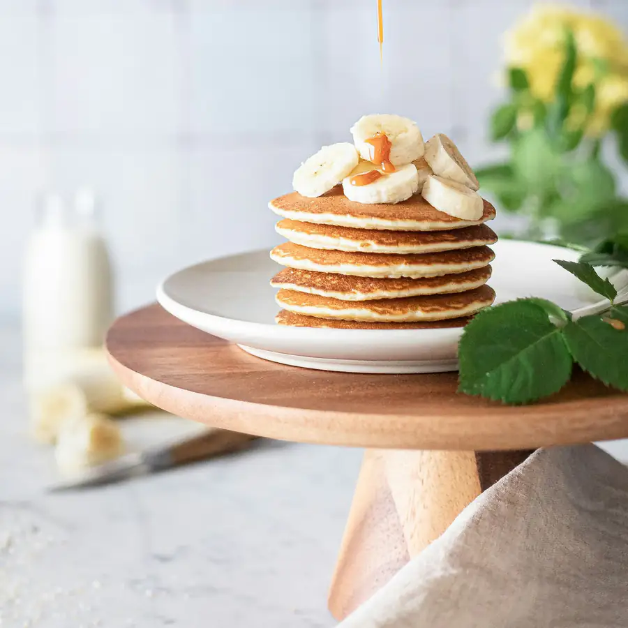 Small stack of pancakes with banana