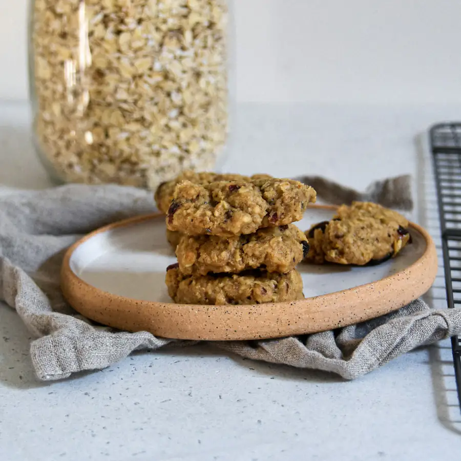 Stack of oat cookies on a wooden board