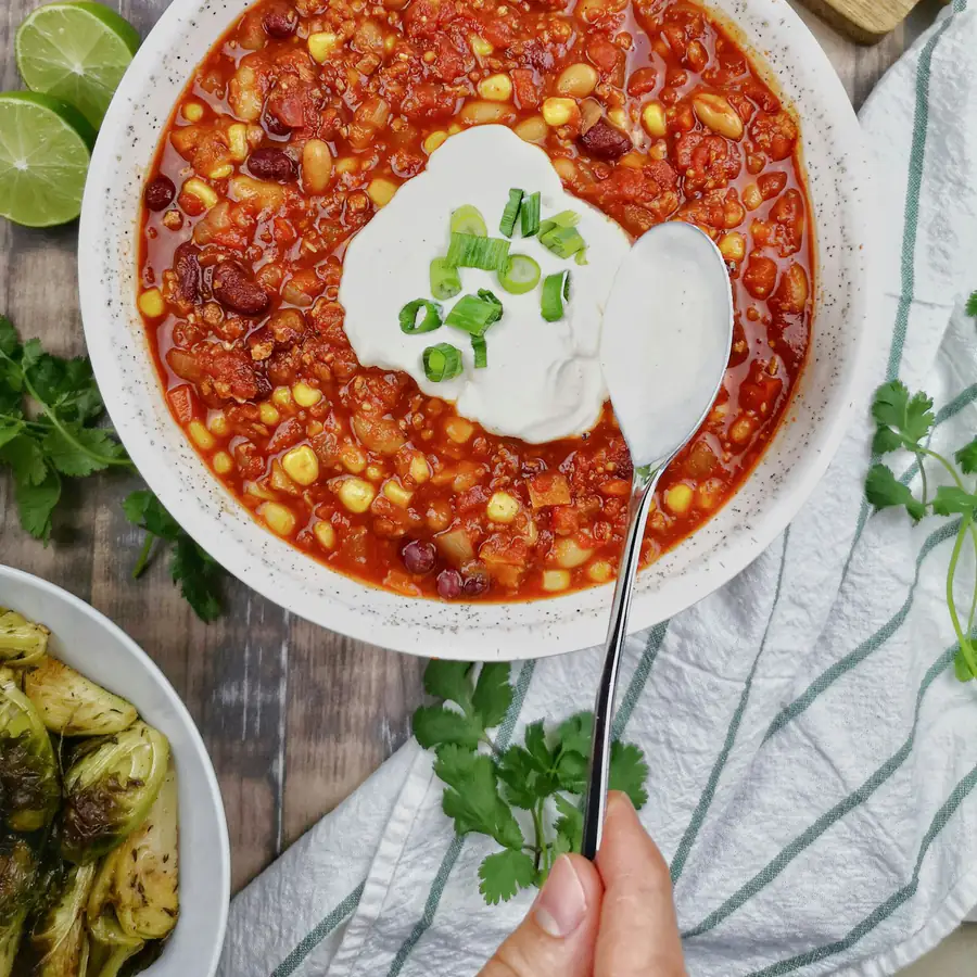 Bowl of bean chilli with sour cream