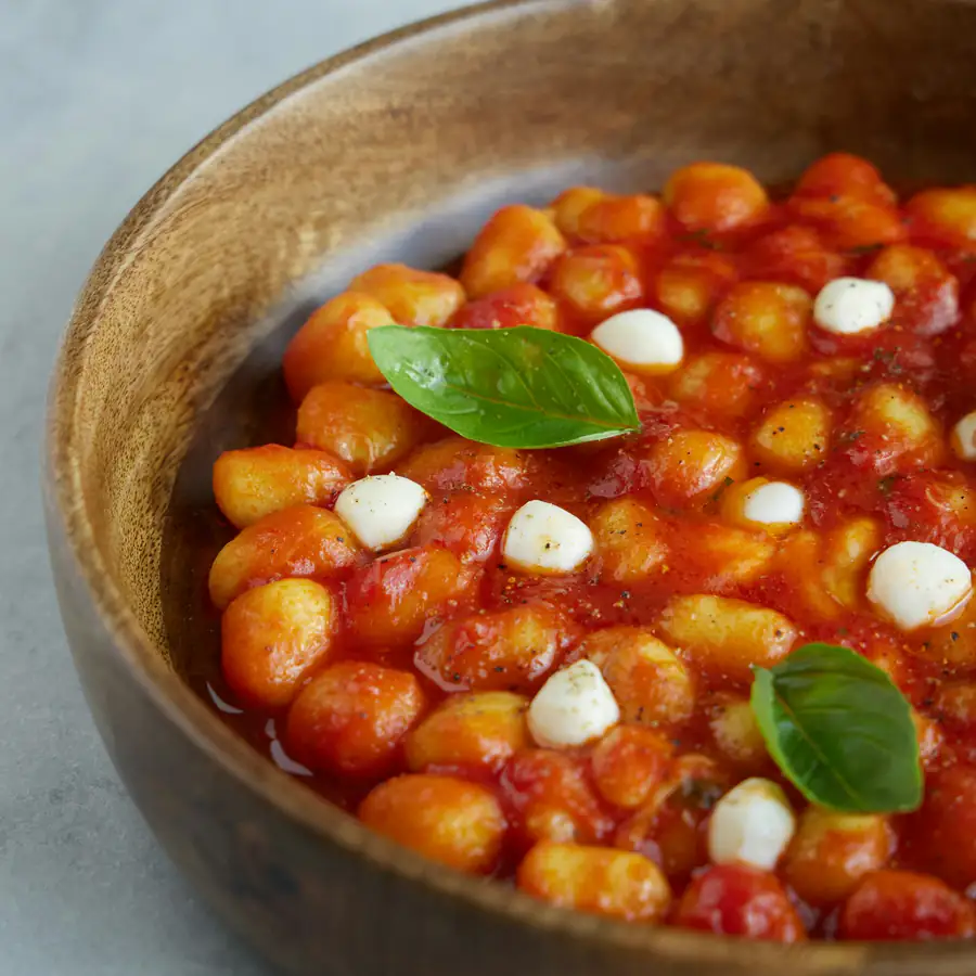 Dish of gnocchi with tomato and mozzarella