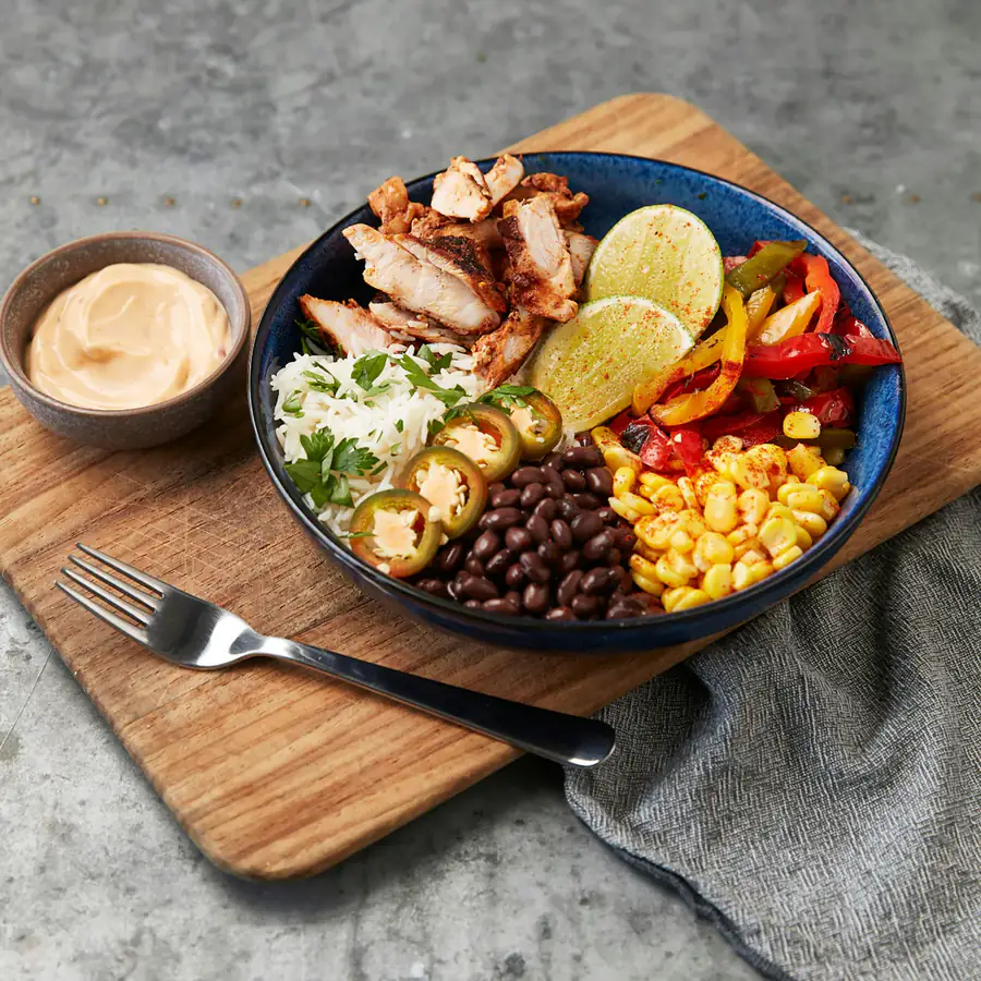 Burrito bowl with rice, beans, corn and chicken