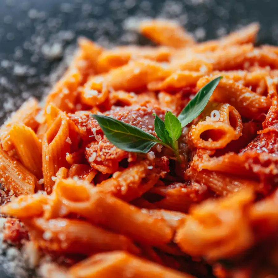 Penne in a creamy tomato sauce with basil