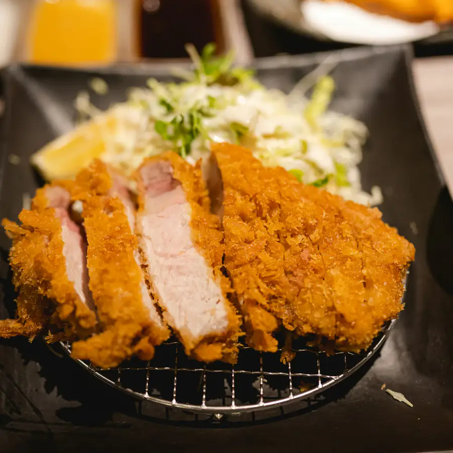 Sliced breaded katsu cutlet with shredded cabbage