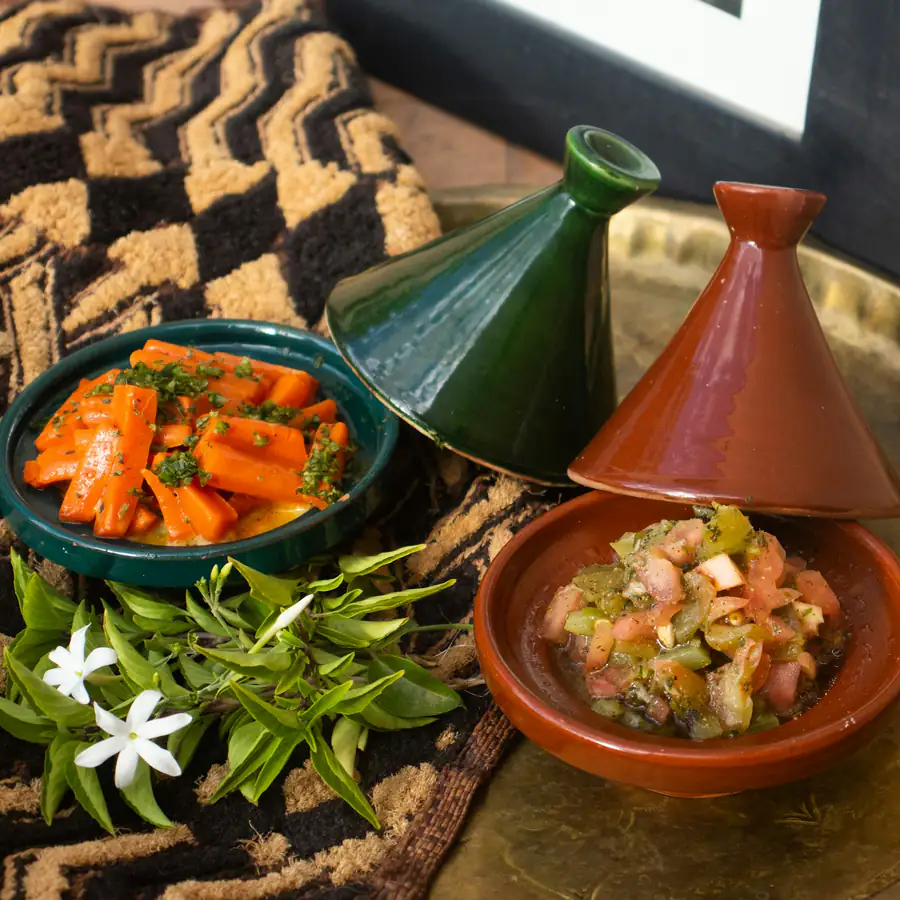 Tagine pots with spiced vegetable stew