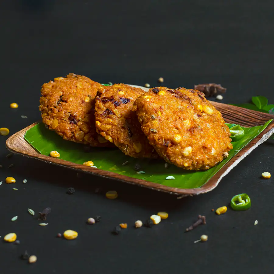 Golden sweetcorn fritters on a board