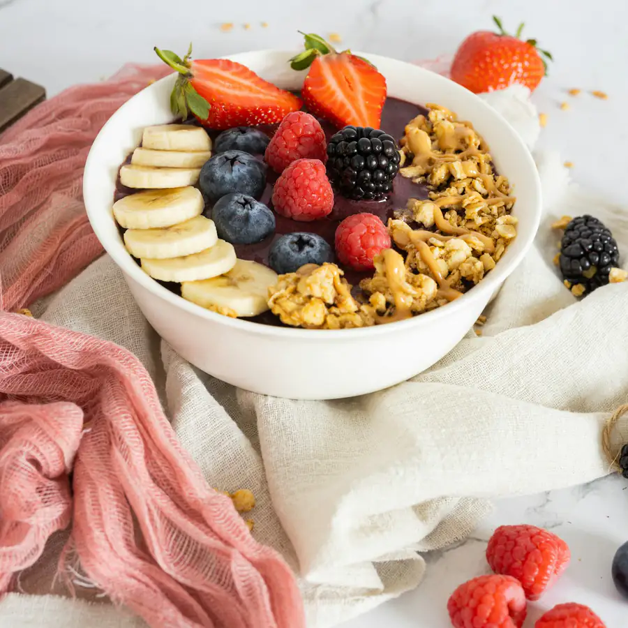 Bowl of oats with banana and berries