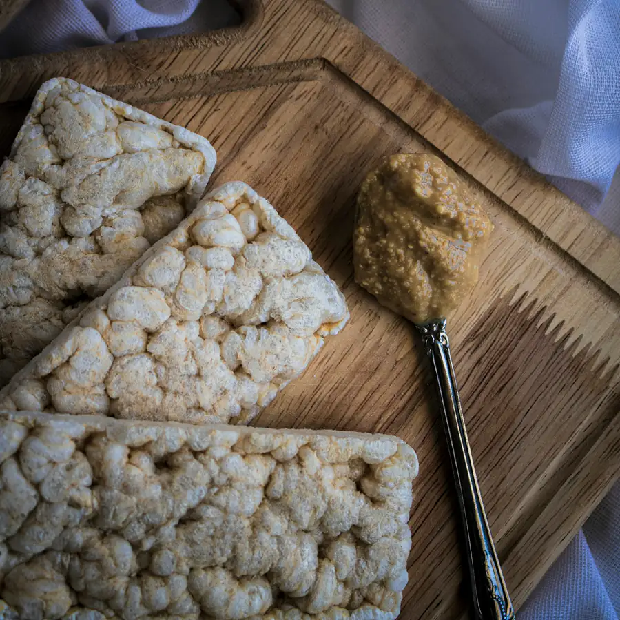 Rice cakes on a board with a spread