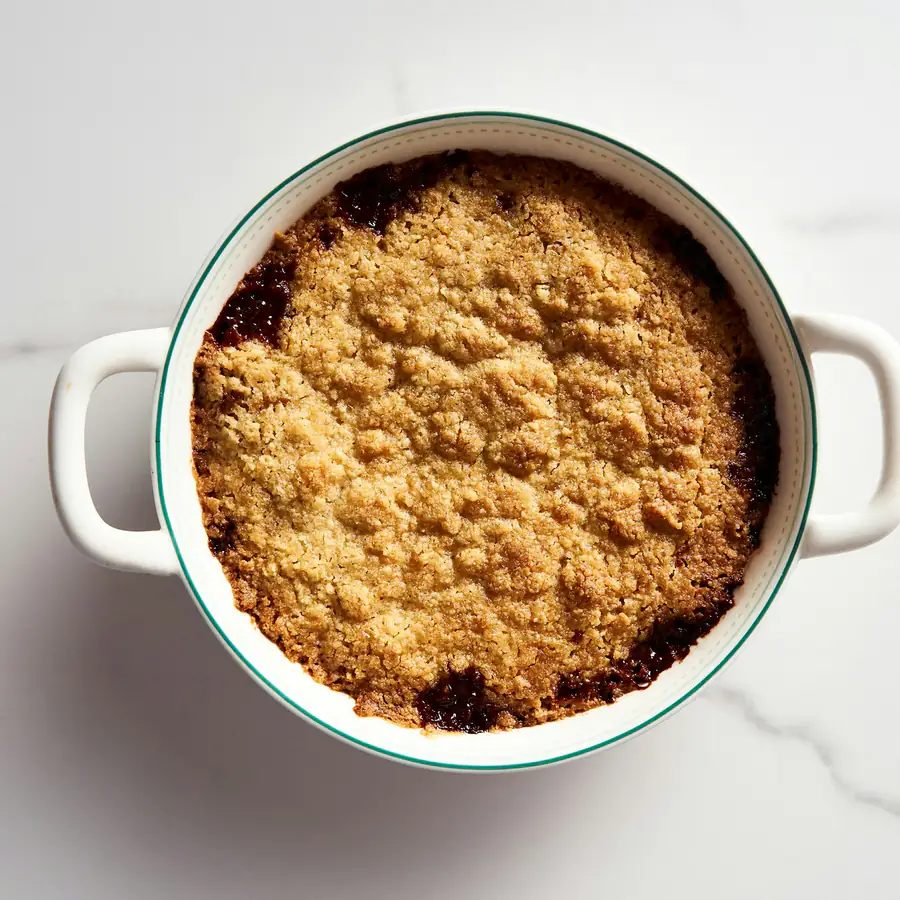 Fruit crumble with a golden topping in a baking dish