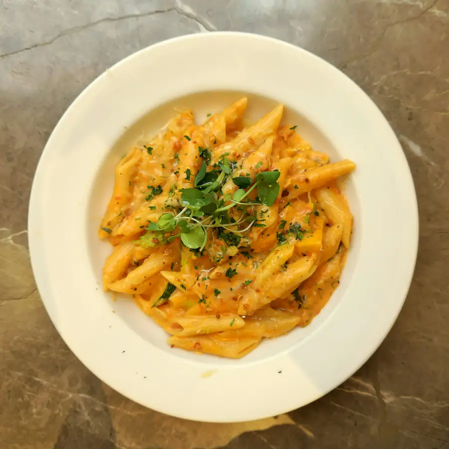 Plate of penne in a golden butternut sauce