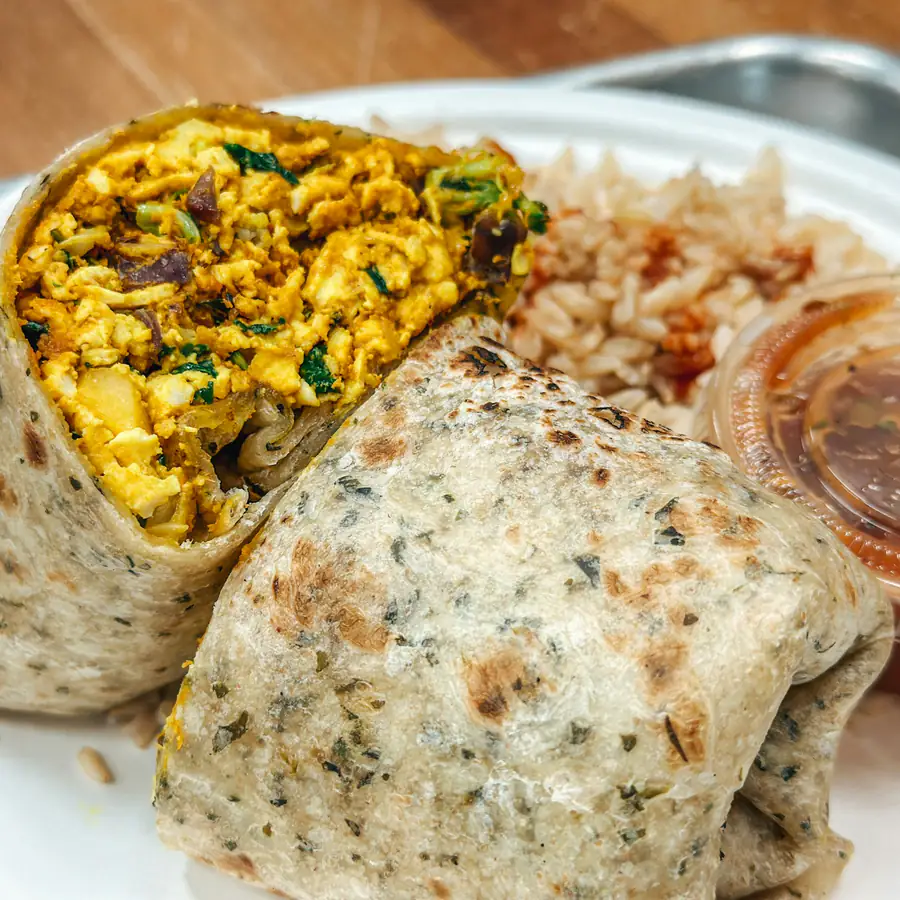Breakfast burrito with scrambled egg, cut in half