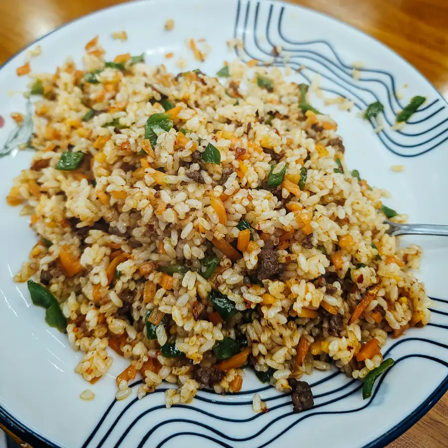 Plate of rice cooked with mince and vegetables