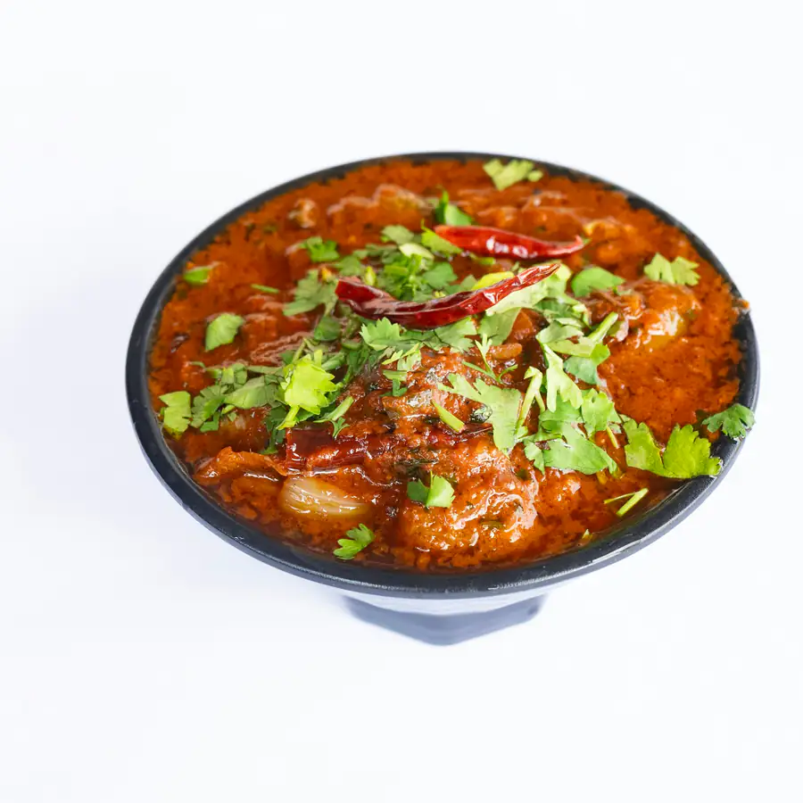 Bowl of chilli topped with herbs