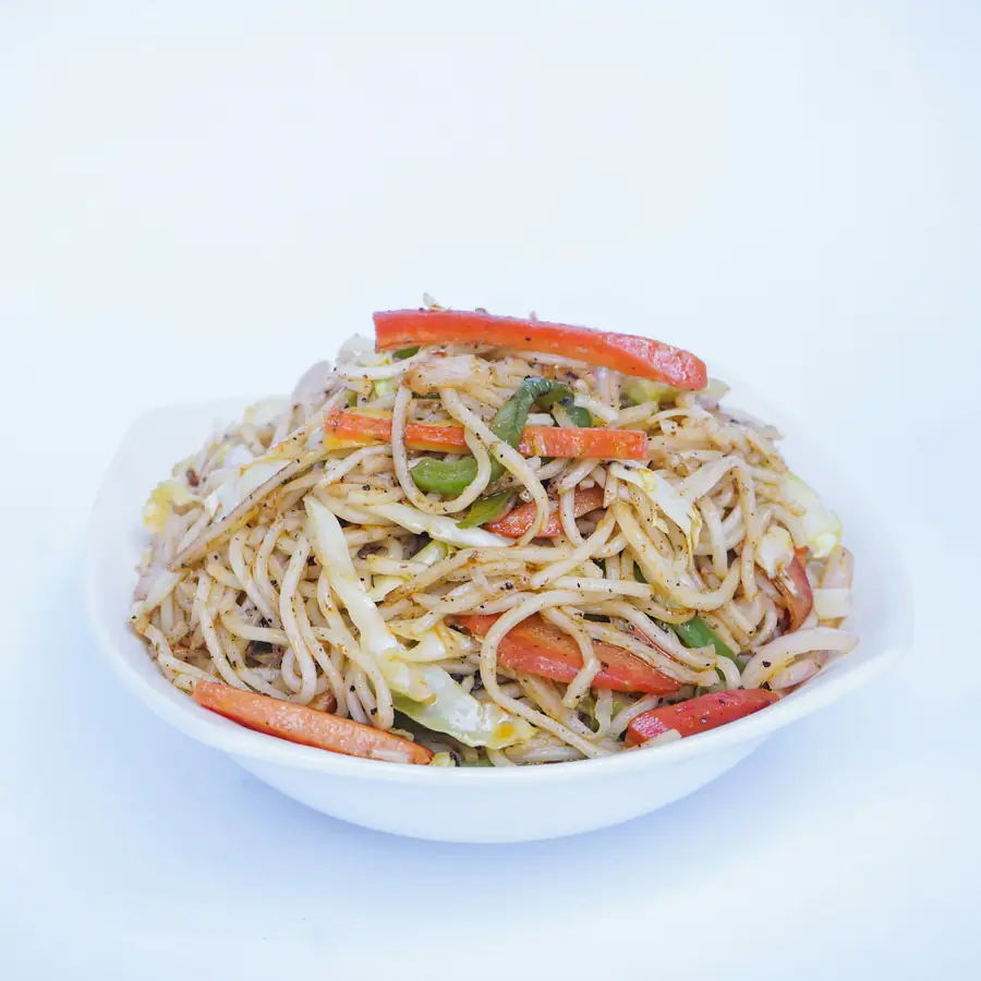 Bowl of mild noodles with vegetables