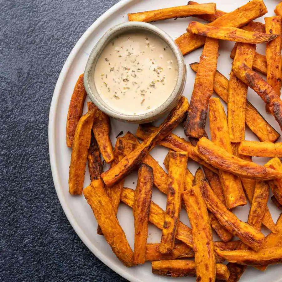 Plate of sweet potato fries with a dip