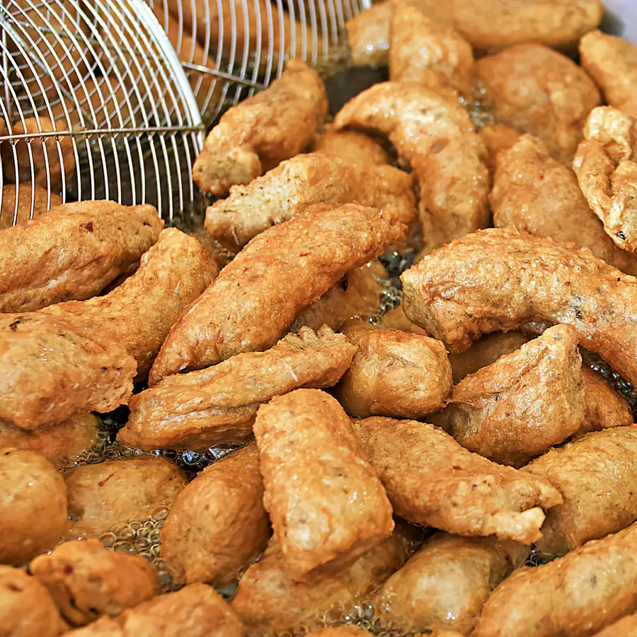 Fishcakes frying until golden