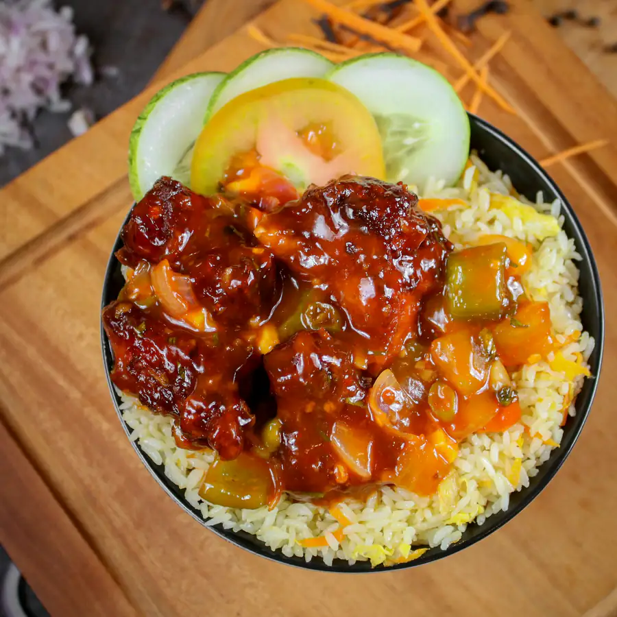 Bowl of rice topped with sticky glazed chicken