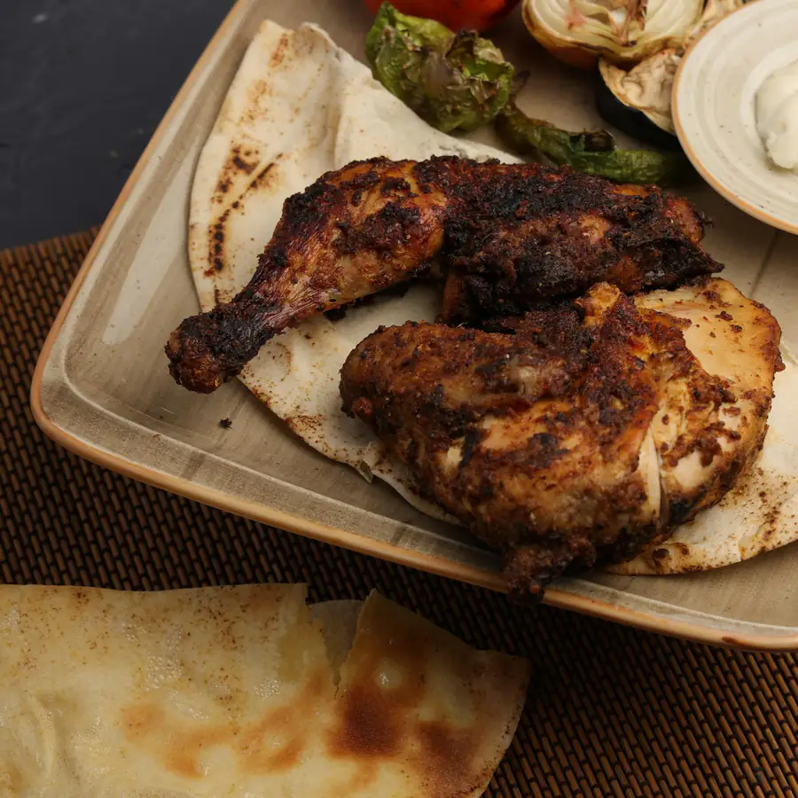 Spiced chicken with warm flatbreads