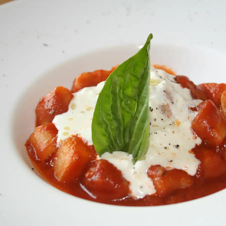 Gnocchi baked in tomato sauce with basil