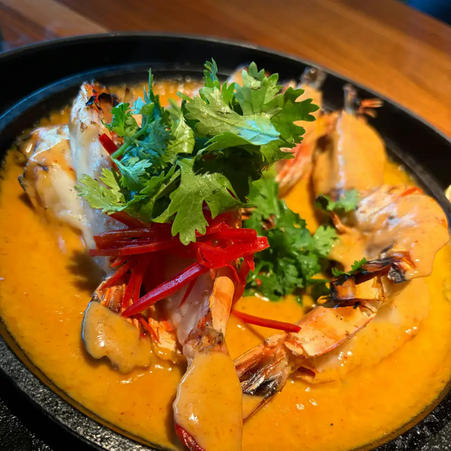 Pan of Thai red curry with herbs