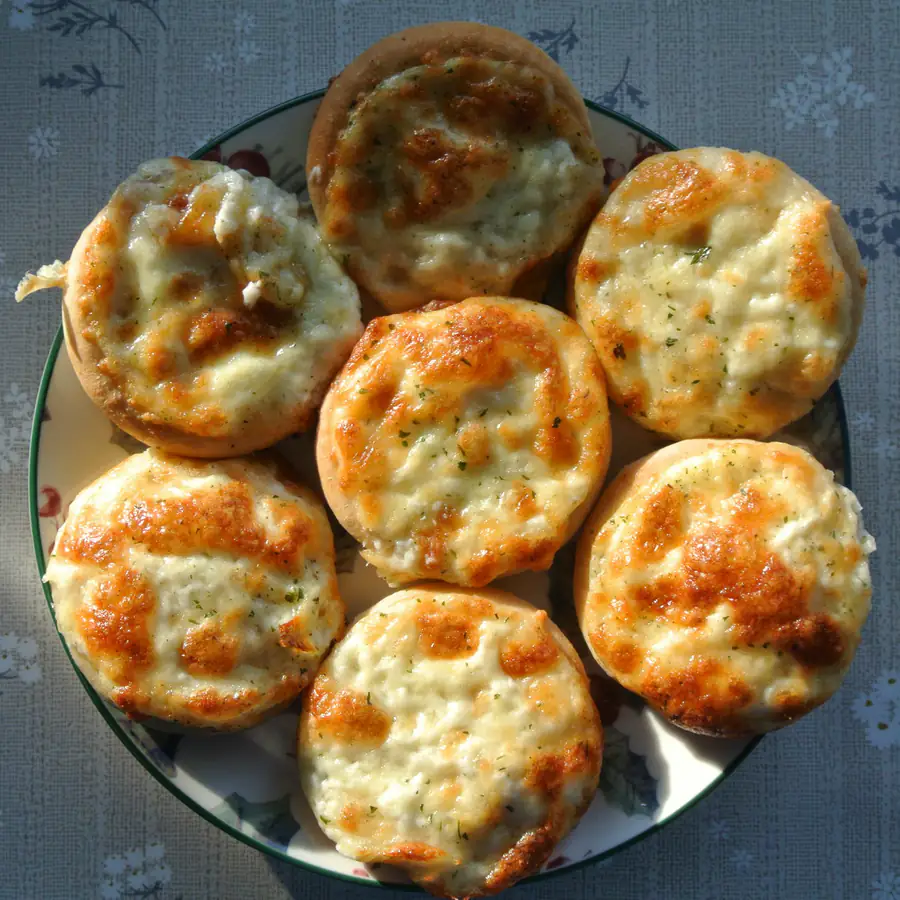 Cheesy savoury muffins on a cooling rack