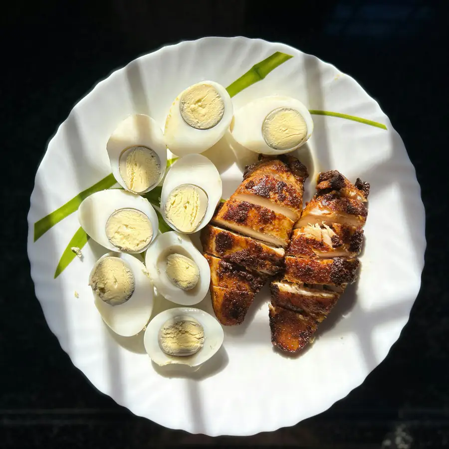 Sliced cooked chicken breast on a plate