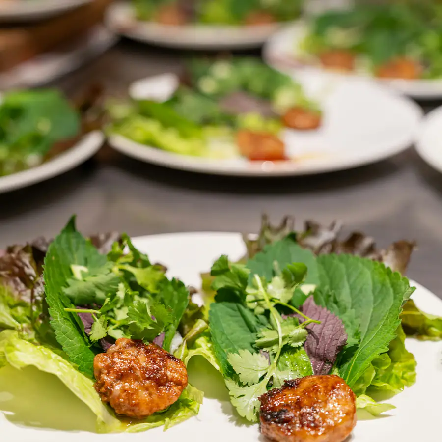 Lettuce cups filled with seasoned meat and herbs